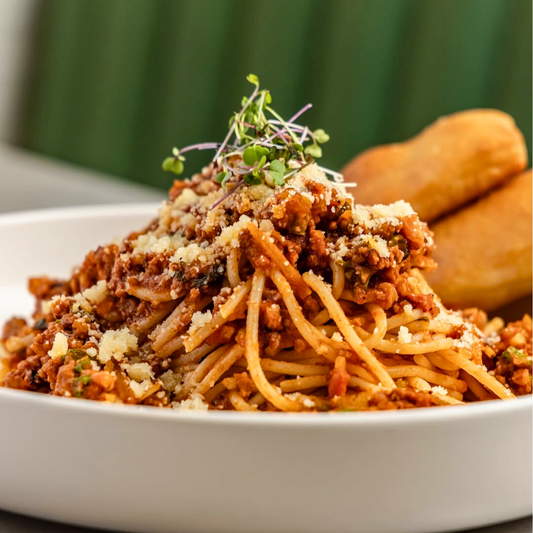 Pasta Bolognese + Sándwich Mediterráneo + Pizza de 12" + Jarra de Soda + 4 Copas de Helado por $25 en Valenti's