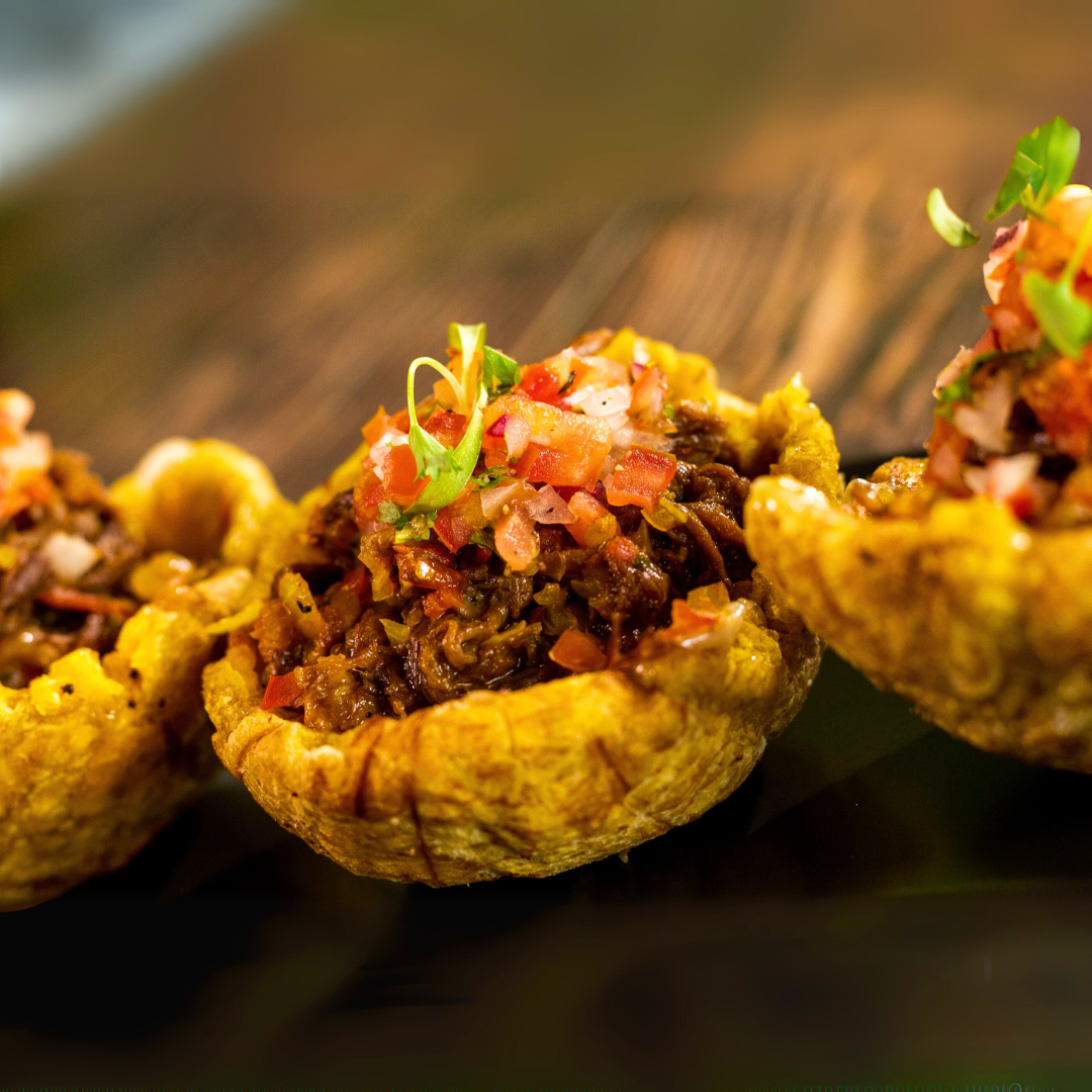 Orden de Chicharrones con Patacones + 2 Órdenes de Tostones con Ropa Vieja + 2 Bebidas por $20 en Carpe Diem Terrace