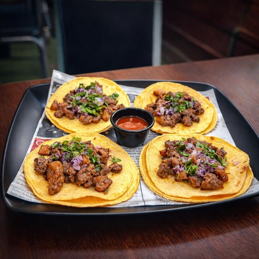 4 Tacos + 4 Quesadillas + Orden de Nachos + 2 Bebidas por solo $15 en Bokattos