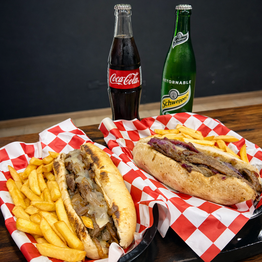 2 Philly Cheesesteak + Papas + Bebidas desde $14 en Alitas Salvajes PUB