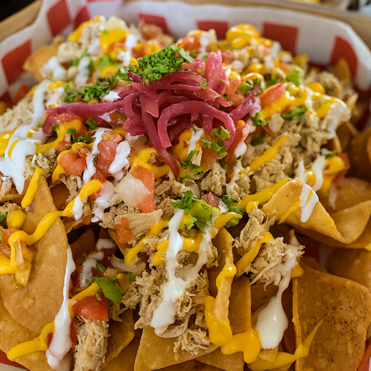 2 Órdenes de Tacos + Nachos con Pollo + 2 Sodas por $15 en Taquería Q’ Onda Guey