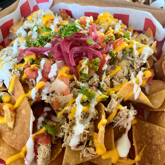 2 Órdenes de Tacos + Nachos con Pollo + 2 Sodas por $15 en Taquería Q’ Onda Guey
