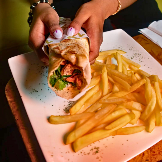 2 Shawarmas de Pollo con Yuca o Papas + 2 Cervezas Cristal por $15 en Zibâ Mediterranean Cuisine