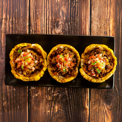 Orden de Chicharrones con Patacones + 2 Órdenes de Tostones con Ropa Vieja + 2 Bebidas por $20 en Carpe Diem Terrace