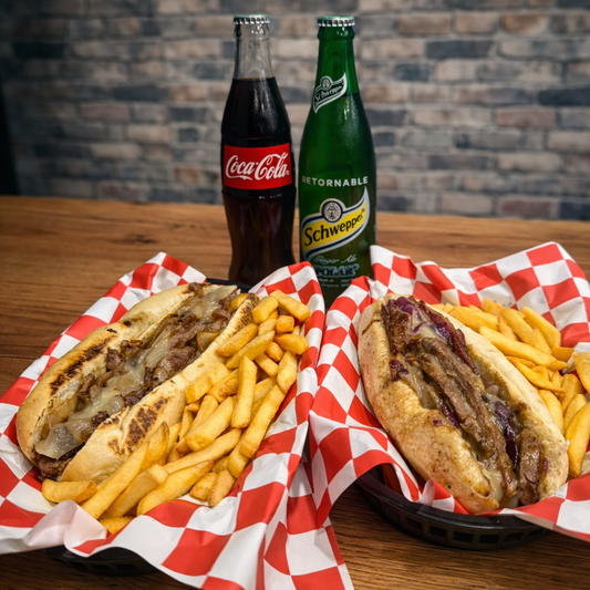 2 Philly Cheesesteak + Papas + Bebidas desde $14 en Alitas Salvajes PUB