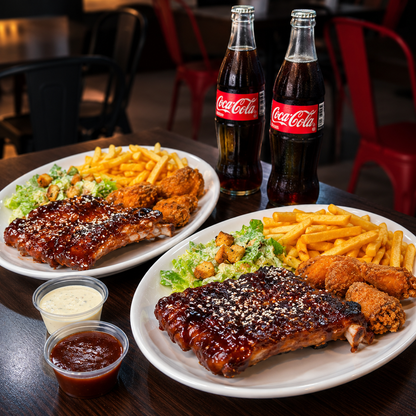 2 Platos con Costillas BBQ, Alitas, Papas Fritas y 2 Bebidas por $15 en Alitas Salvajes Pub