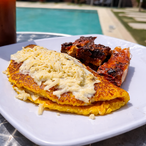 Pasadía con Piscina + 2 Platos con Cachapas + Costillas + 2 Bebidas para 2 personas