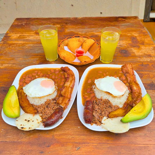 2 Bandejas Paisa + Entrada de Empanadas + 2 Bebidas por $15 en Delicias del Fogón Latino